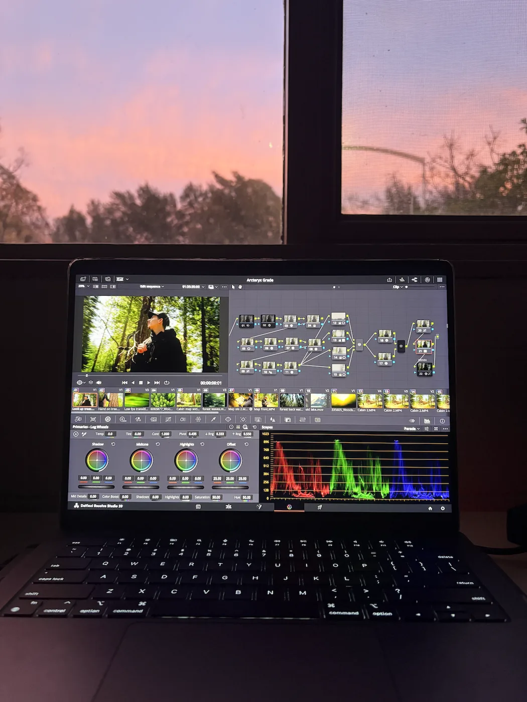 Colour grading on a laptop at sunset